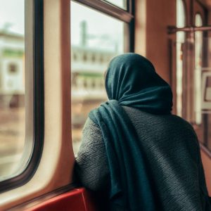 woman looking outside the window